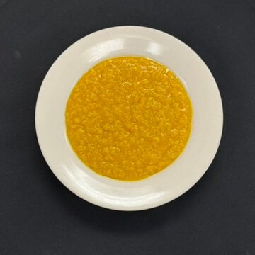 Ethiopian Kik Alicha—yellow split peas slow-cooked with turmeric, garlic, and onions, served on injera.